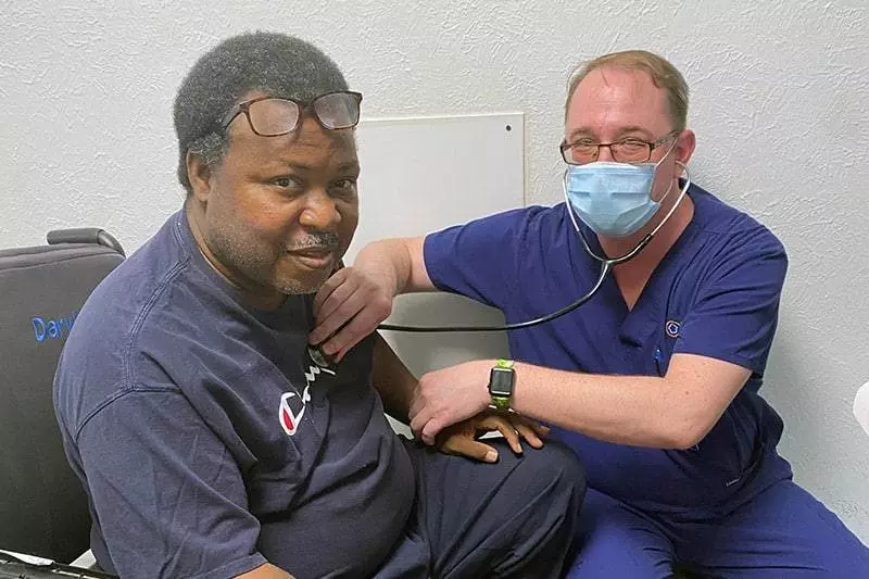 man having blood pressure checked